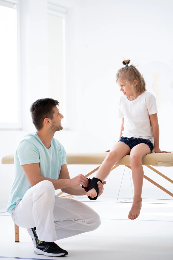 injured girl wearing an ankle brace